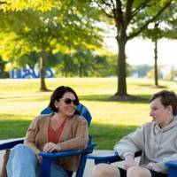 People sitting in lawn chairs on Kirkhof Lawn.